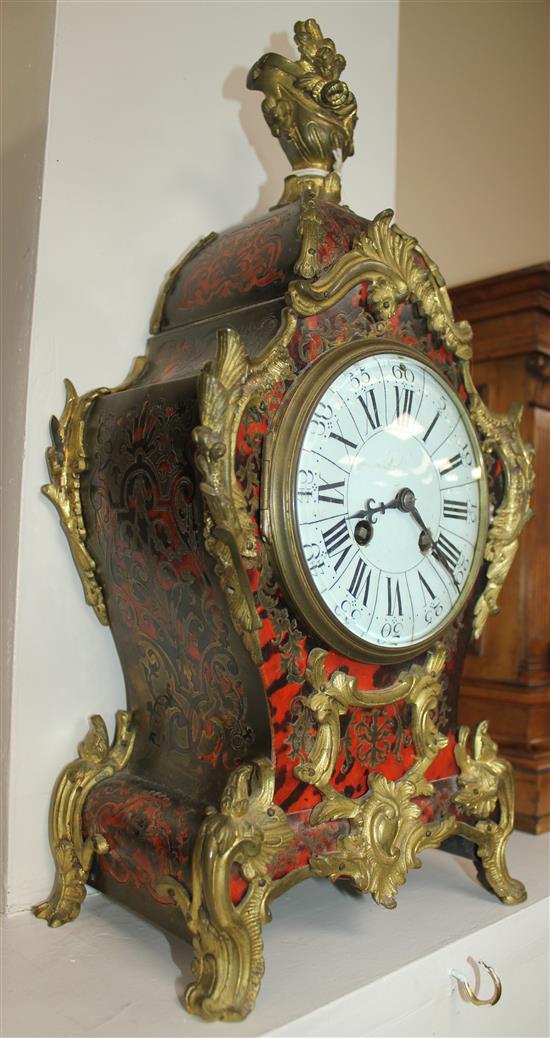 A French ormolu mounted red boulle mantel clock, 16in.